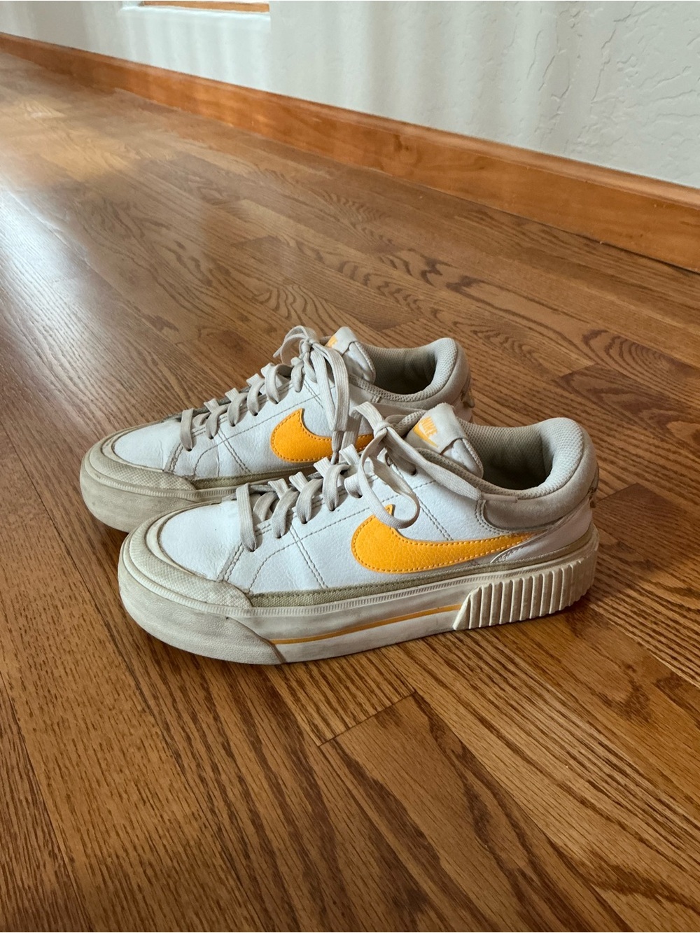 Nike White Sneakers with Yellow Swoosh